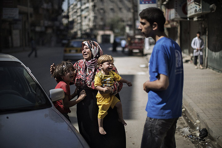 Twenty Photographs: Members of a Syrian family cry outside a hospital in Aleppo