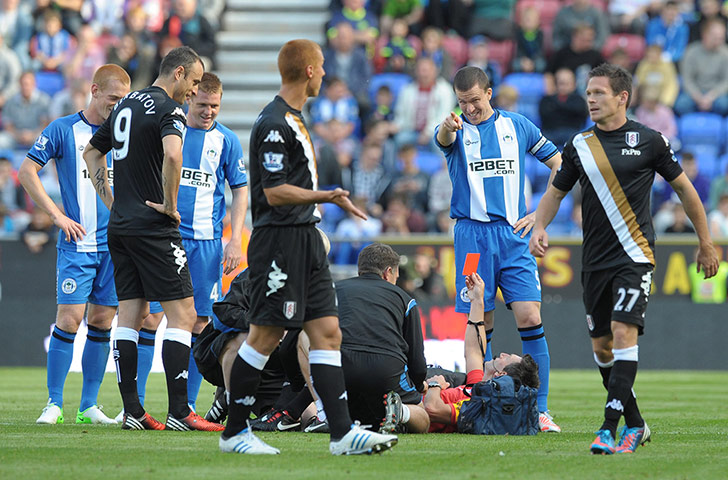 saturday roundup: Referee Lee Probert receives treatment