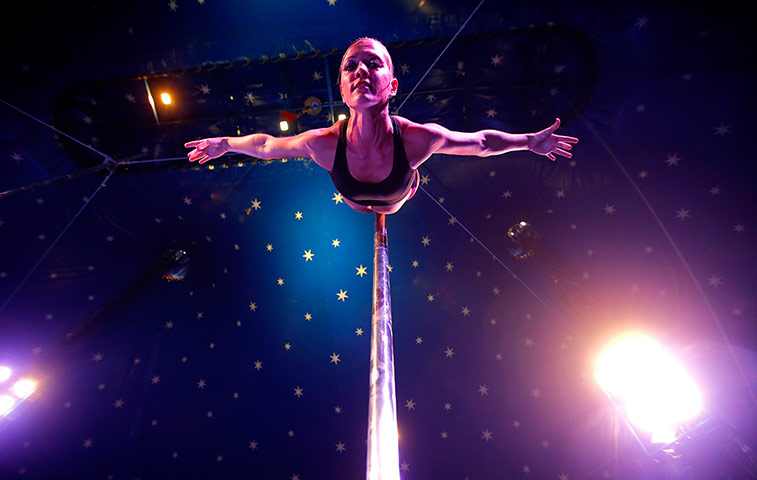 24 hours: Budapest, Hungary: Eszter Szlavi warms up before pole dancing competition