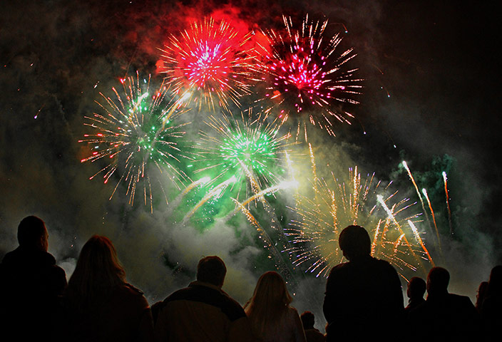 24 hours: Vilnius, Lithuania: Fireworks light up the sky over Vingio Park 