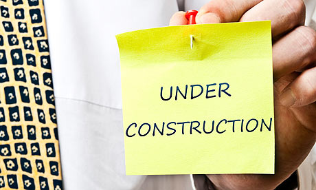 Under construction post it