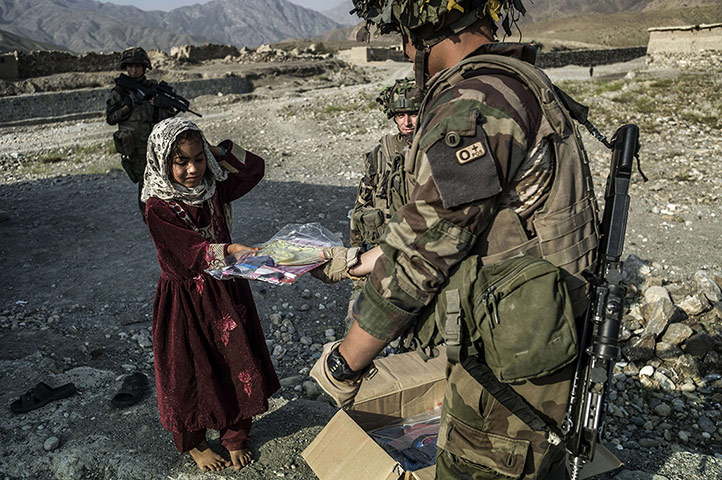 24 hours in pictures: An Afghan child is given a kite