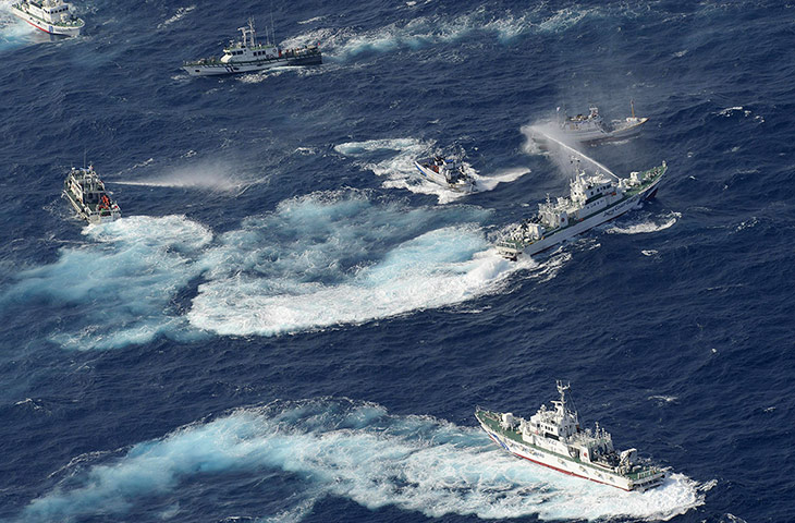 24 hours in pictures: A Japan Coast Guard vessel sprays water