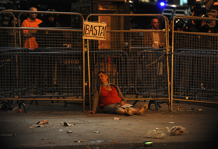 Madrid update: An injured woman lies on the street