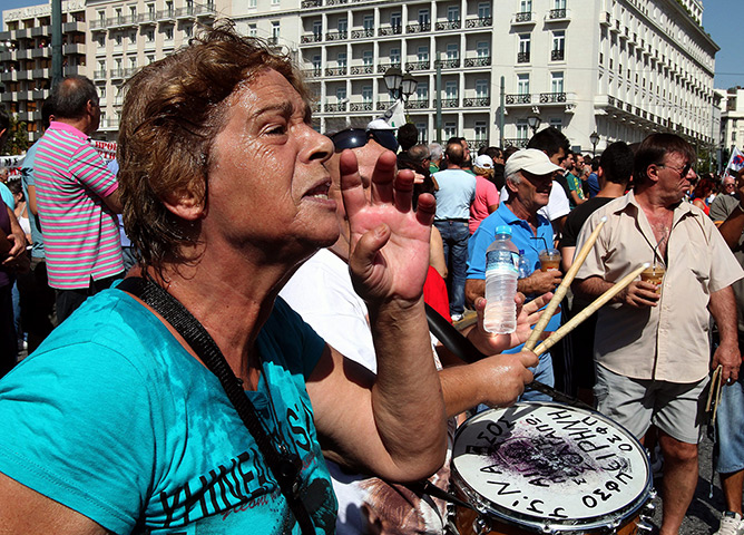 Greece protests: Demonstrators shout slogans in front of the Greek Parliament