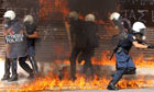 Riot police engulfed in flames during violent clashes demonstration in Athens