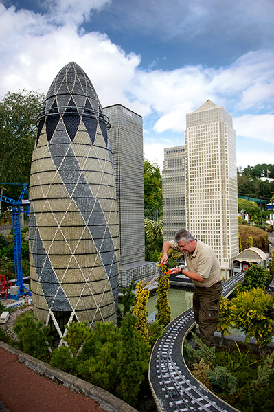 Legoland gallery: Landscape Technician John Isted trims the plants around the model Gherkin