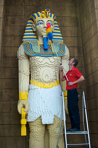 Legoland gallery:  Model Maker Chris Convoy cleans the 6m high pharaoh