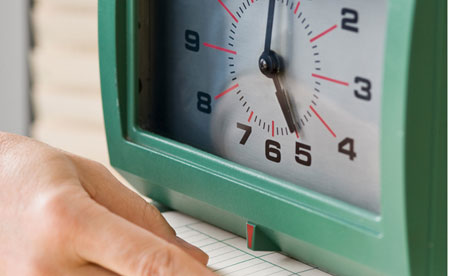 Man punching card in time clock