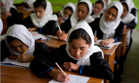 Afghan schoolgirls attend a class