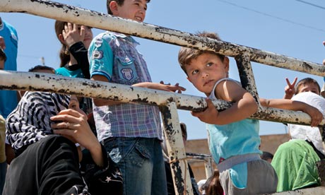 Syrian children ride in truck