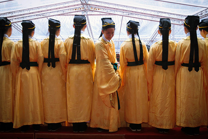 24 hours in pictures: Children dressed as ancient Chinese scholars