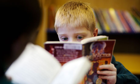 A boy reading in his school library