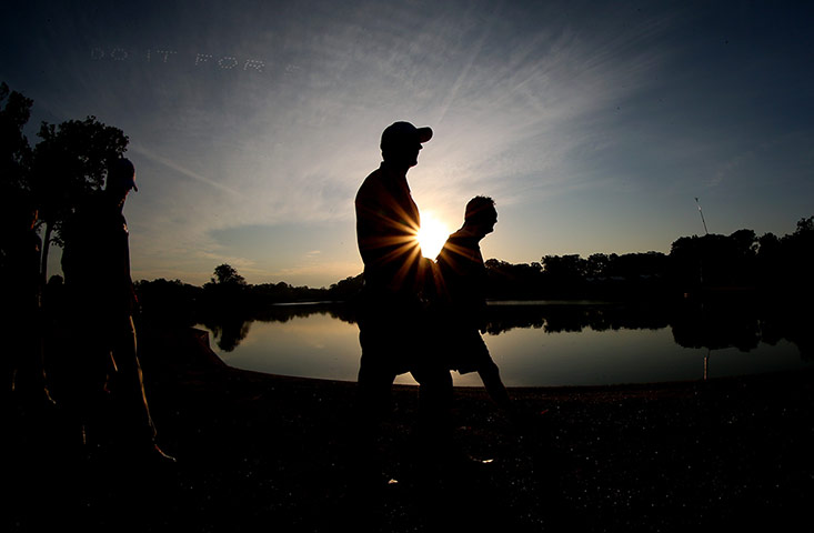 Ryder Cup day 2: Justin Rose of Europe walks with his caddie Mark Fulcher