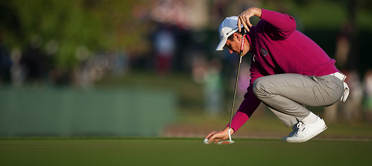 Ryder Cup day 2: Justin Rose of England lines up his putt on the 2nd 