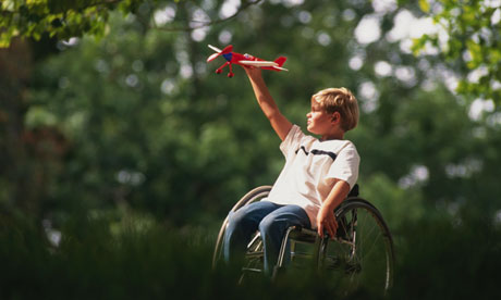 Boy in Wheelchair with Toy Airplane