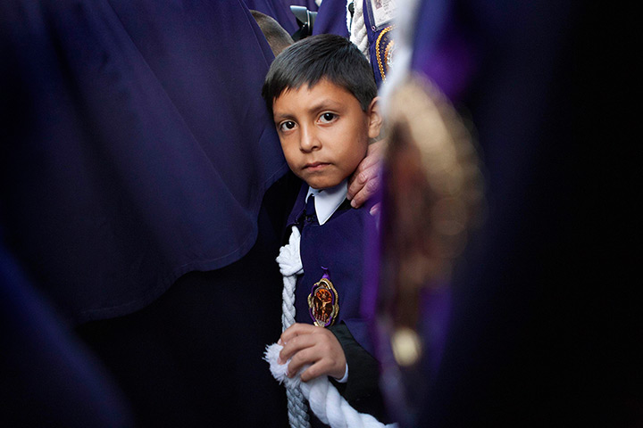 24 hours: Lima, Peru: A child participates in a procession