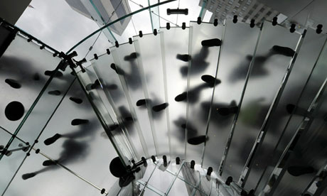 Customers walk down the spiral staircase