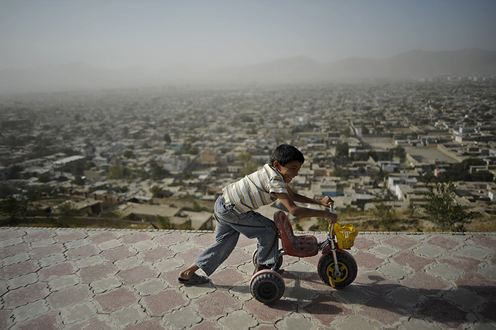 24 hours: Kabul, Afghanistan: An Afghan child plays on top of Wazir Akbar Khan hill 