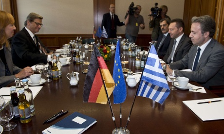 German Foreign Minister Guido Westerwelle (2nd from L) and Greek Finance Minister Yannis Stournaras (2nd from R) hold talks