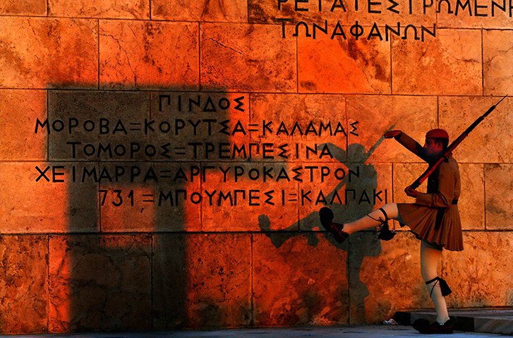 24 hours: Athens, Greece: A Greek presidential guard marches