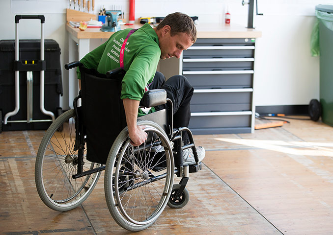 ottobock workshop: A technician test rides a wheelchair