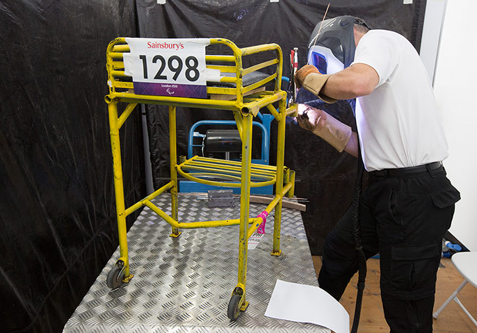 ottobock workshop: A technician welds a throwing frame