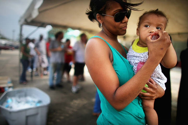 24 hours in pictures: disaster food assistance for those affected by Hurricane Isaac 