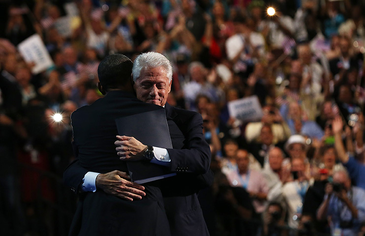 24 hours in pictures: Former President Bill Clinton hugs  President Barack Obama