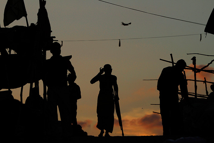 24 hours in pictures: A Hindu walks on the banks of the Ganges River 