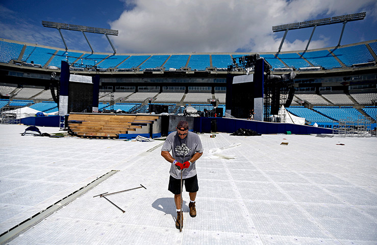 DNC day 2: A worker dismantles the floor at the Bank of America Stadium