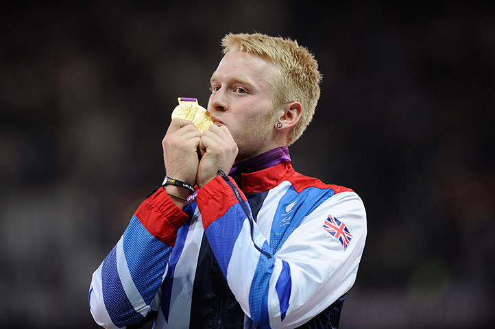 100m final batch 3:  Jonnie Peacock of GB with the gold medal.