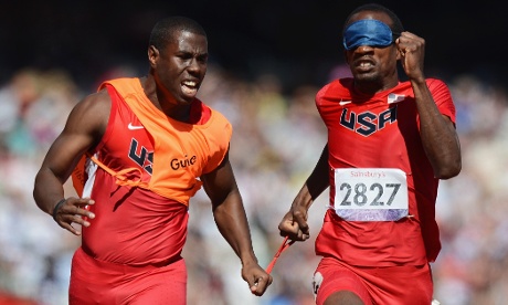 Elexis Gillette and his guide Wesley Williams of the United States compete in the Men's 100m    T11 heats.