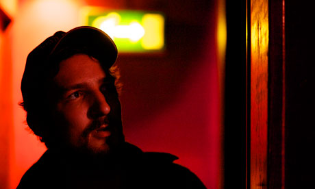 Frank Turner waits in the shadows before going on stage