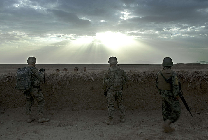 24 hours in pictures: US soldiers and an Afghan colleague in Kandahar province