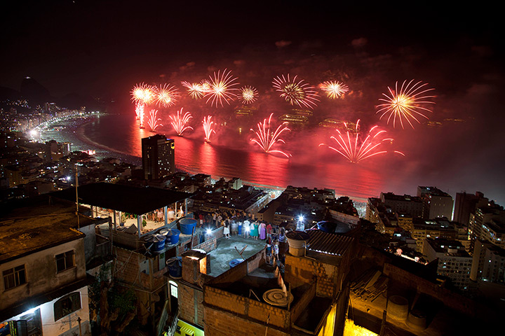 New Year fireworks: People watch fireworks exploding over Copacabana beach in Rio de Janeiro