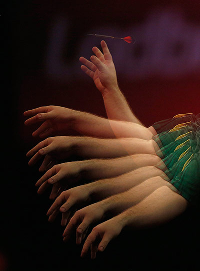 darts: A multiple exposure image shows the throwing action of Brendan Dolan