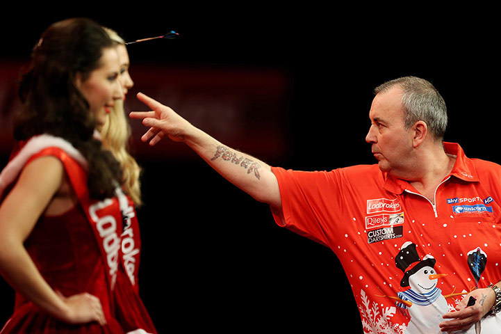 darts: Phil Taylor and the Oche girls looking rather festive