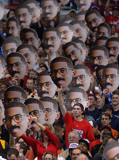 24 hours in pictures: Fans hold up pictures of Los Angeles Clippers guard Chris Paul 