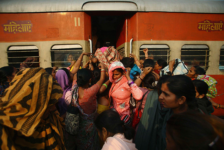 Trains for women: Women try to enter the ladies' compartment of a crowded train