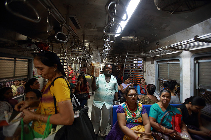 Trains for women: A vendor sells food inside the Ladies' Special train in Mumbai
