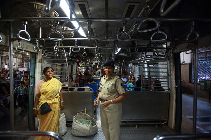 Trains for women: A police officer stands in the Ladies' Special train