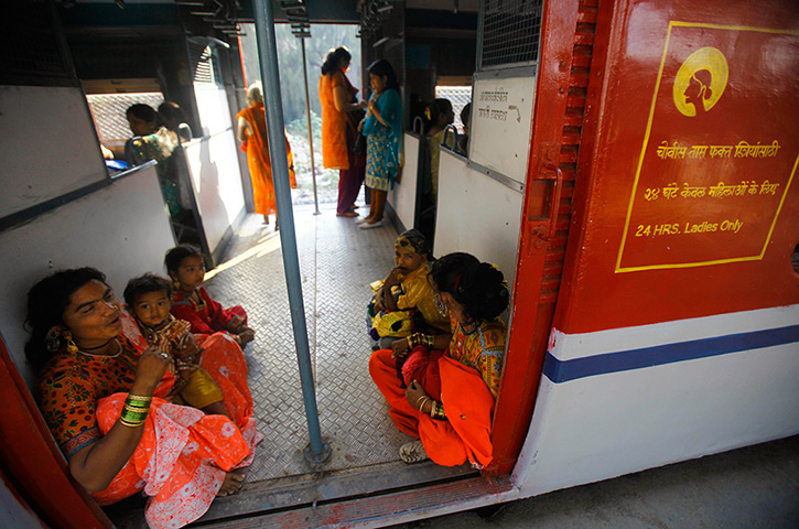 Trains for women: Women sit near the doors as they travel in the women's compartment