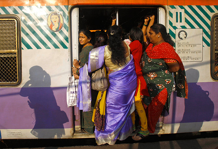 Trains for women: Women stand in the door of the women's compartment of a train