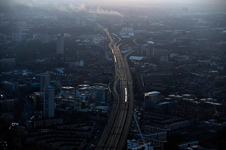 Shard view: Commuter trains at dawn on the approach to London Bridge station