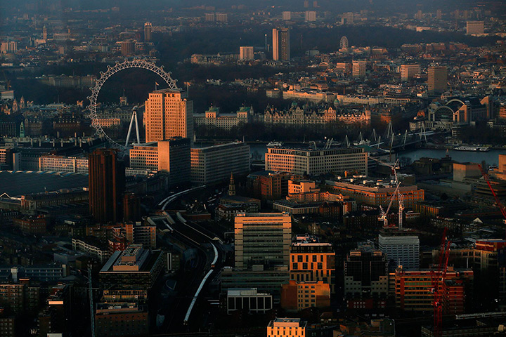 Shard view: The early morning sun hits buildings and the London Eye