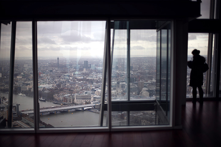 Shard view: A visitor looks out from the Shard viewing platform 