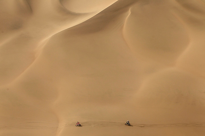 24 hours in pictures: Riders race their motorcycles through dunes