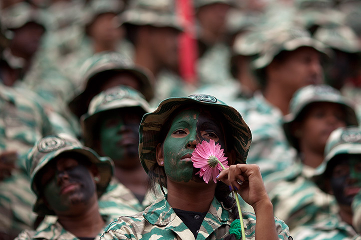 24 hours in pictures: A female member of Venezuela's Bolivarian militia