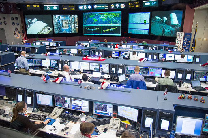 A Month in Space: Flight controllers in the space station flight control room 